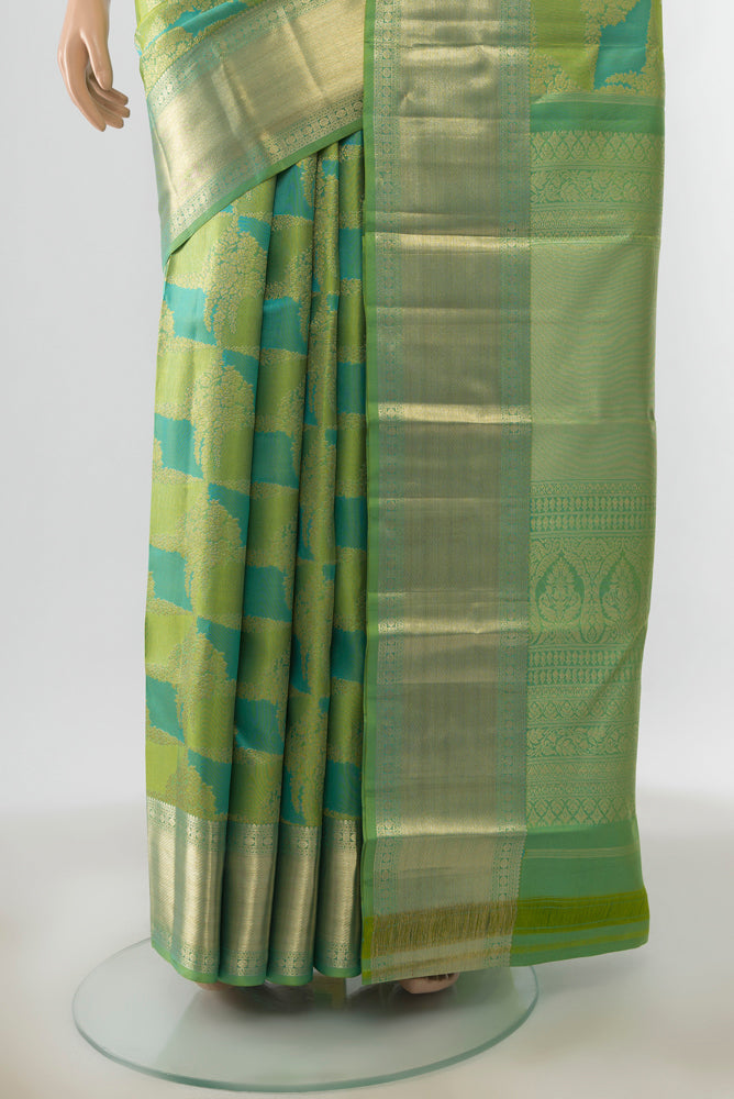 Pleats and pallu of Multi Color Kanjivaram Silk Saree with Zari Butta on the body and Silk Border. 