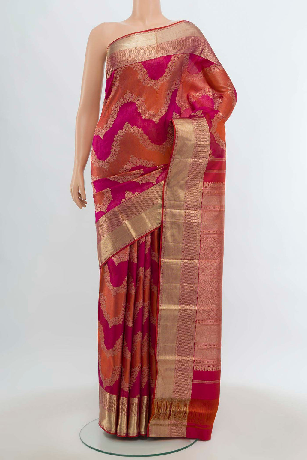 Multi Color Kanjivaram Silk Saree with Zari Butta on the body and Silk Border.  displayed on a mannequin