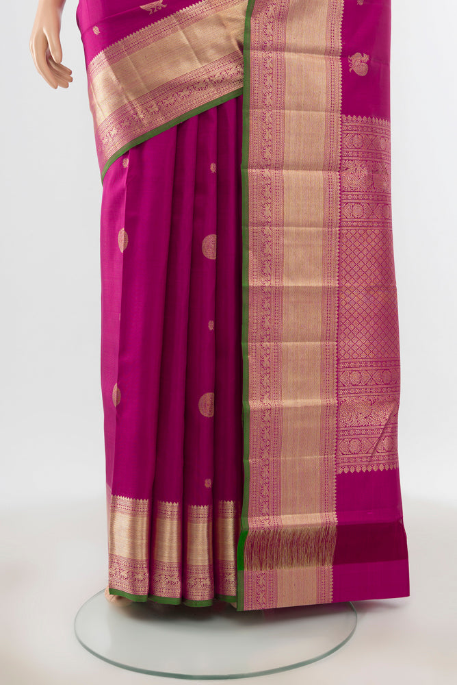 Pleats and pallu of Purple Kanjivaram Silk Saree with Plain Body and Silk Border. 