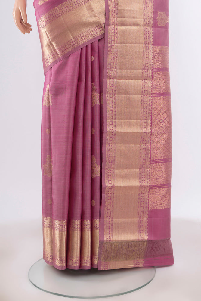 Pleats and pallu of Bronze Kanjivaram Silk Saree with Zari Butta on the body and Silk Border. 