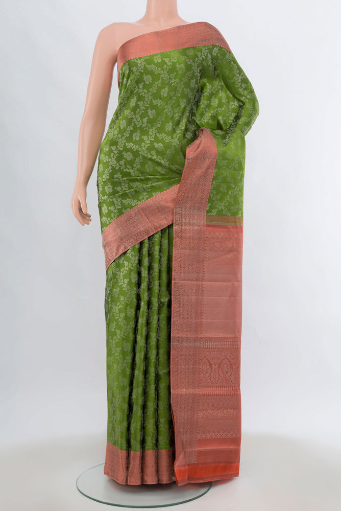 Light Green Kanjivaram Silk Saree with Zari Brocade on the body and Silk Border.  displayed on a mannequin