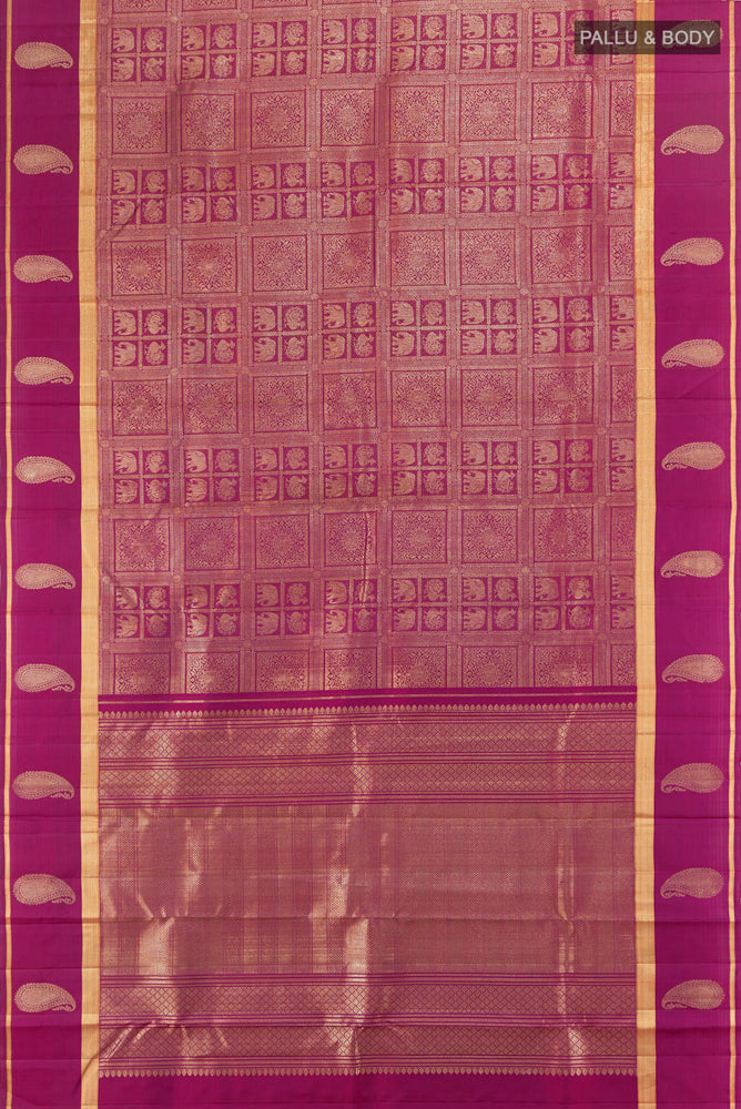 Flat view of Pure Silk Pure Zari Purple Kanchipuram Saree with Zari Butta on the body and Silk Border. 