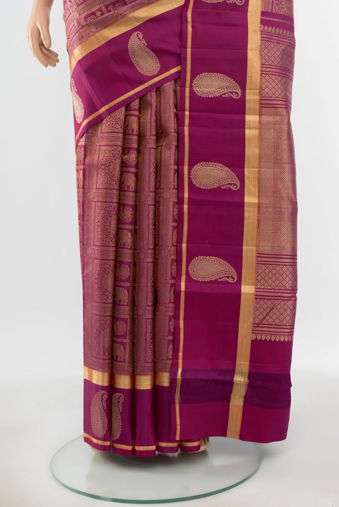 Pleats and pallu of Pure Silk Pure Zari Purple Kanchipuram Saree with Zari Butta on the body and Silk Border. 