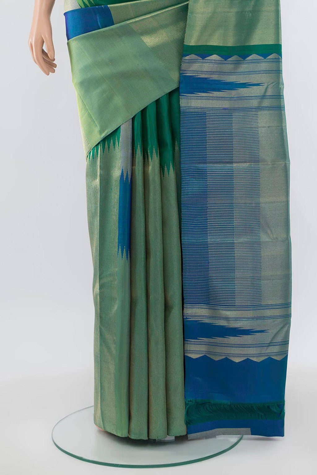 Pleats and pallu of Green Kanchipuram Silk Saree with Zari Butta on the body and Silk Border. 
