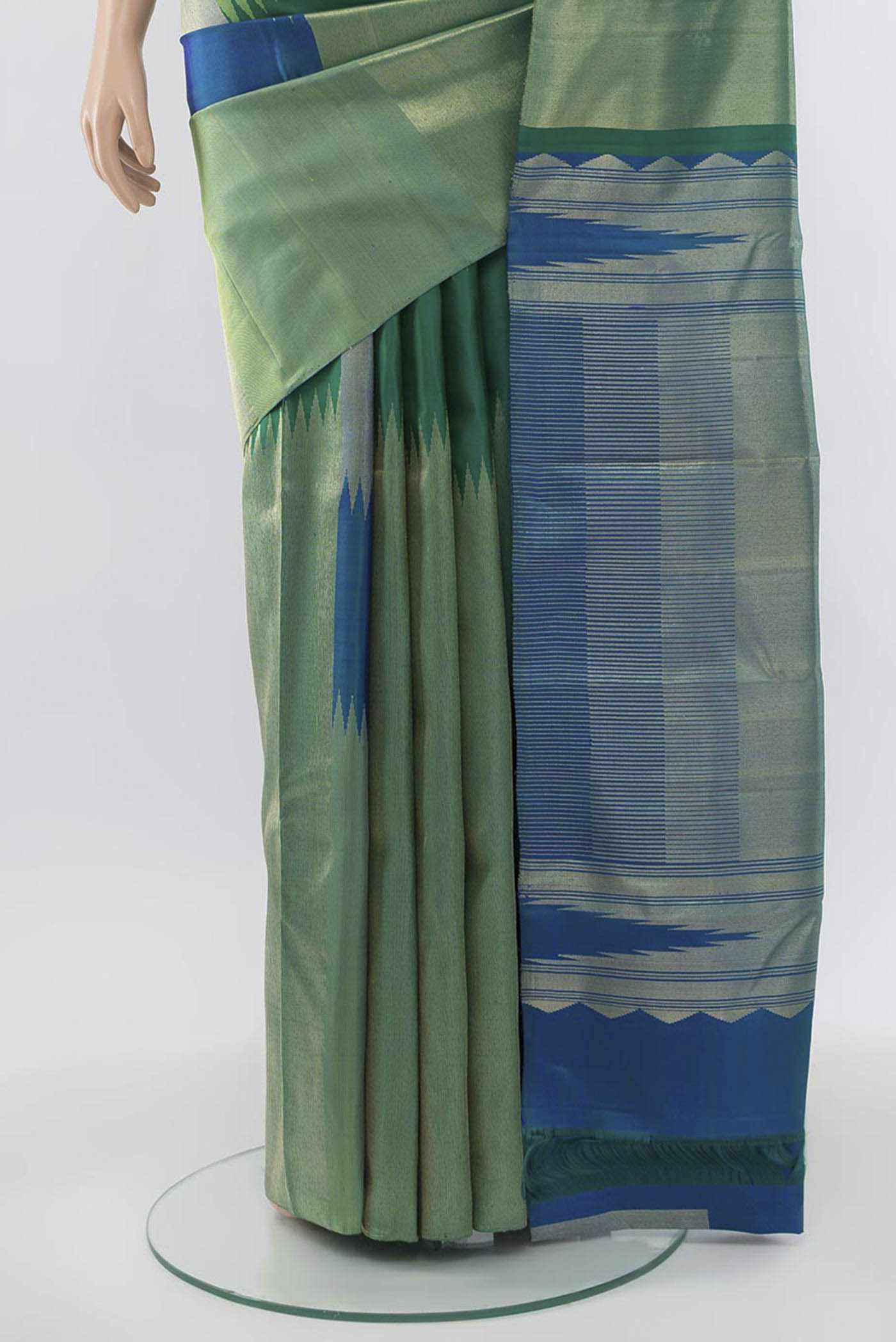 Pleats and pallu of Green Kanchipuram Silk Saree with Zari Butta on the body and Silk Border. 