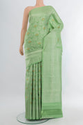 Pista Green Kanchipuram Silk Saree with Zari Brocade on the body and Zari Border.  displayed on a mannequin