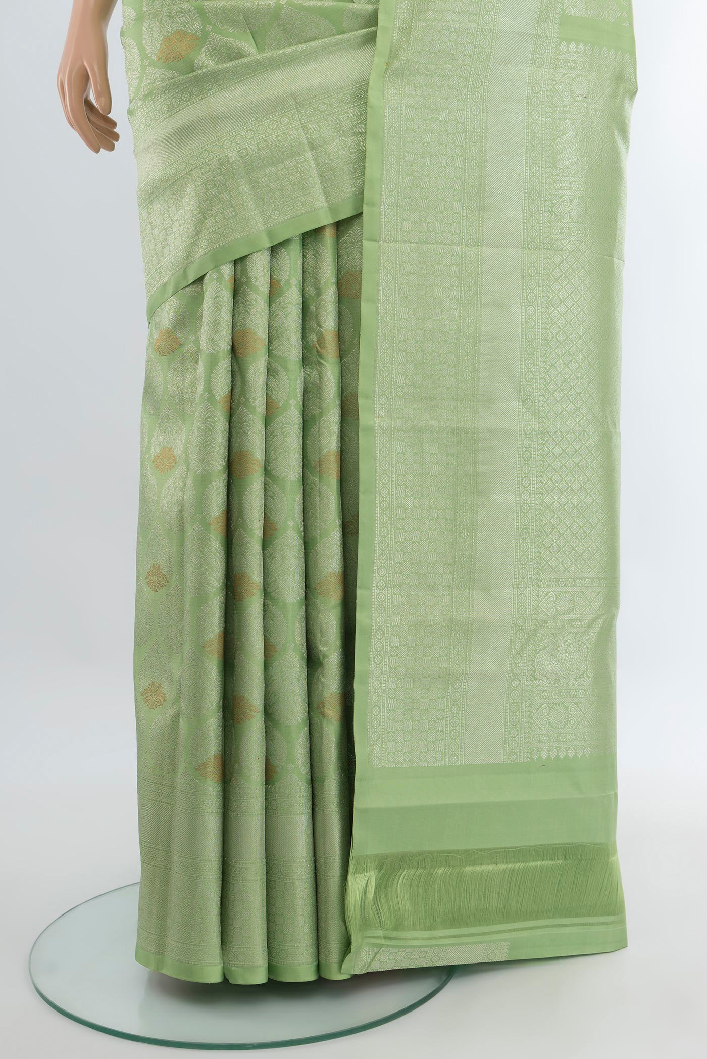 Pleats and pallu of Pista Green Kanchipuram Silk Saree with Zari Brocade on the body and Zari Border. 