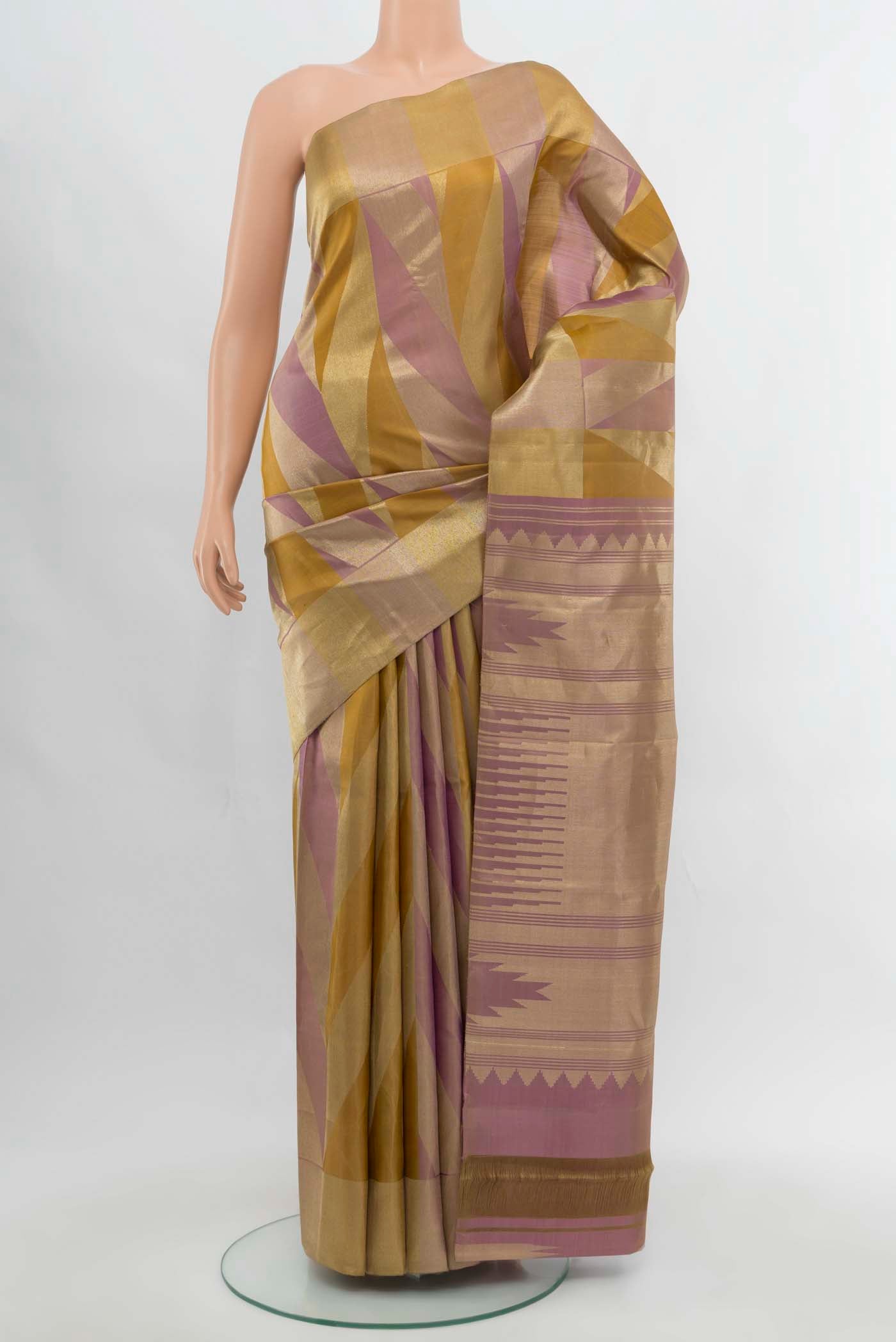 Golden Kanchipuram Silk Saree with Zari Butta on the body and Silk Border.  displayed on a mannequin