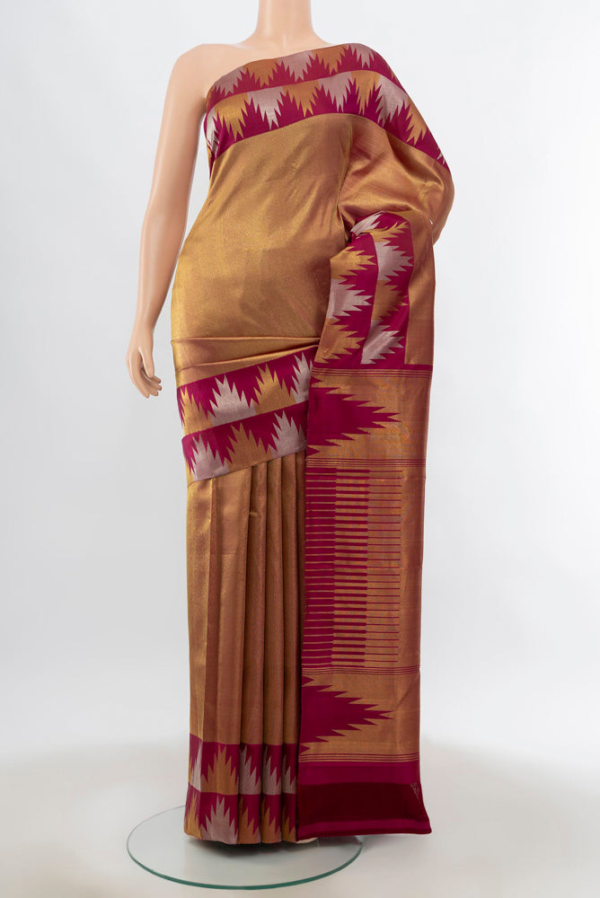 Golden Kanchipuram Silk Saree with Zari Butta on the body and Silk Border.  displayed on a mannequin