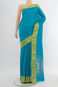 Blue Paithani Silk Saree with Zari Butta on the body and Zari Border.  displayed on a mannequin