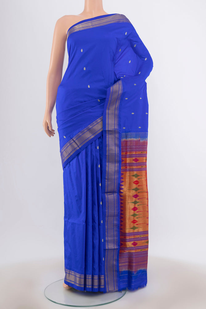 Dark Blue Paithani Silk Saree with Zari Butta on the body and Silk Border.  displayed on a mannequin