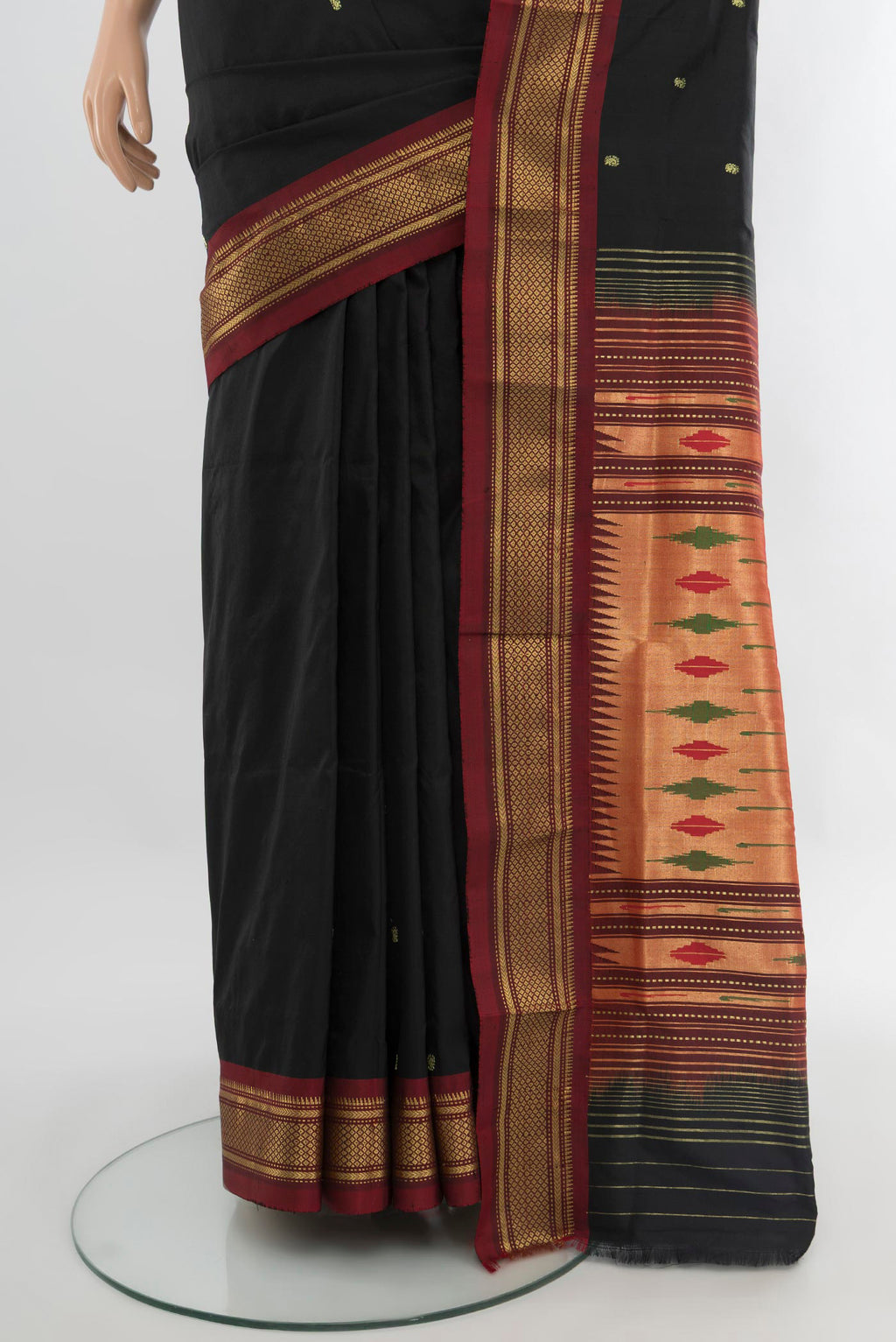 Pleats and pallu of Black Paithani Silk Saree with Zari Butta on the body and Zari Border. 
