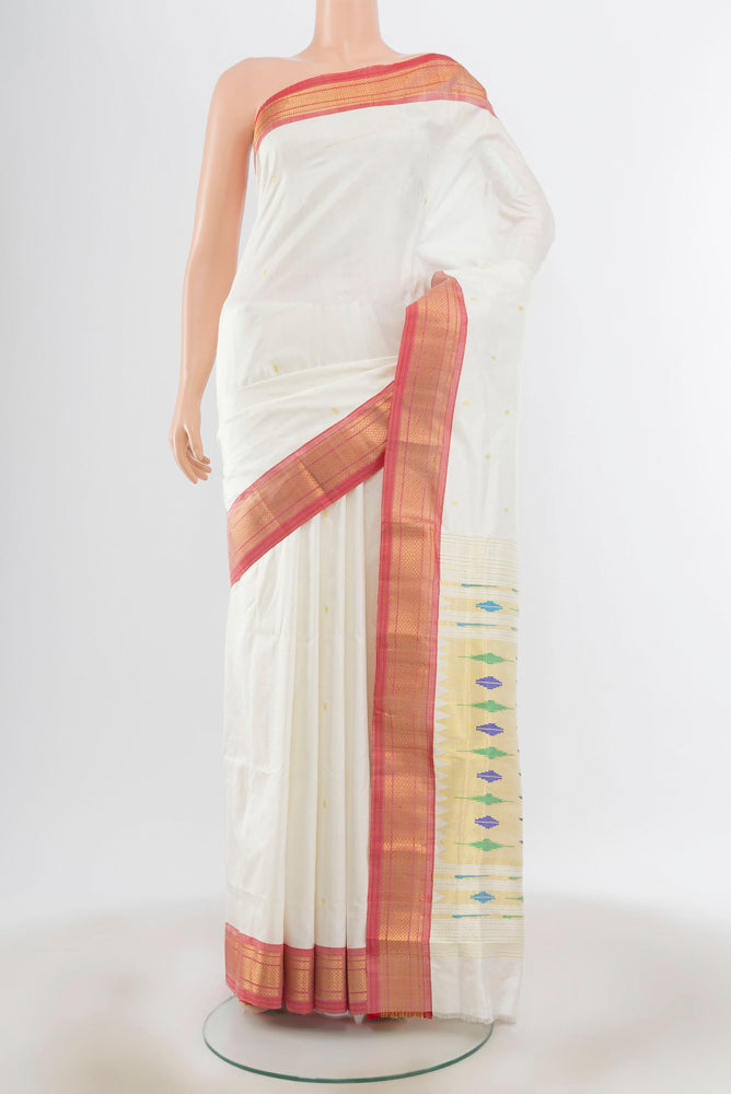 Cream Paithani Silk Saree with Zari Butta on the body and Silk Border.  displayed on a mannequin