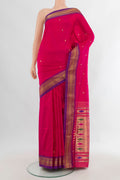 Pure Silk Rani Pink Paithani Saree with Zari Butta on the body and Zari Border.  displayed on a mannequin