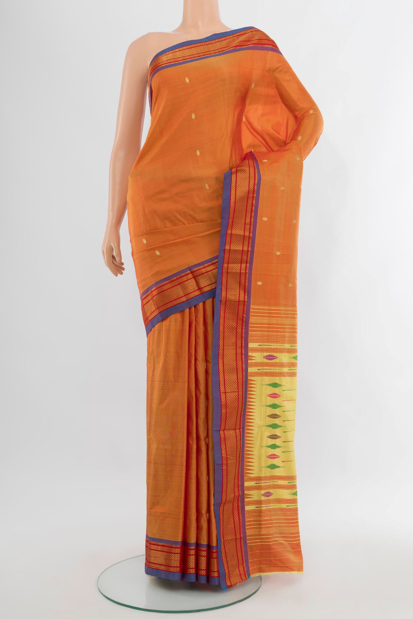 Mustard Paithani Silk Saree with Zari Butta on the body and Zari Border.  displayed on a mannequin