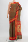 Mehandi Green Dual Tone Paithani Silk Saree with Zari Butta on the body and Zari Border.  displayed on a mannequin
