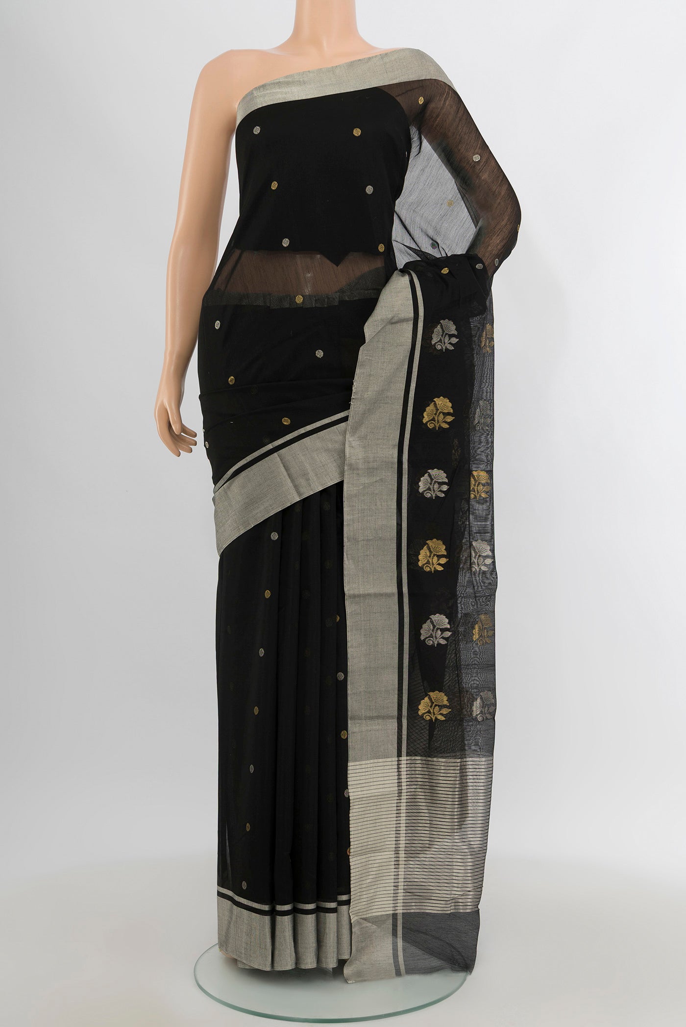 Black Chanderi Silk Cotton Saree with Zari Butta on the body and Zari Border.  displayed on a mannequin