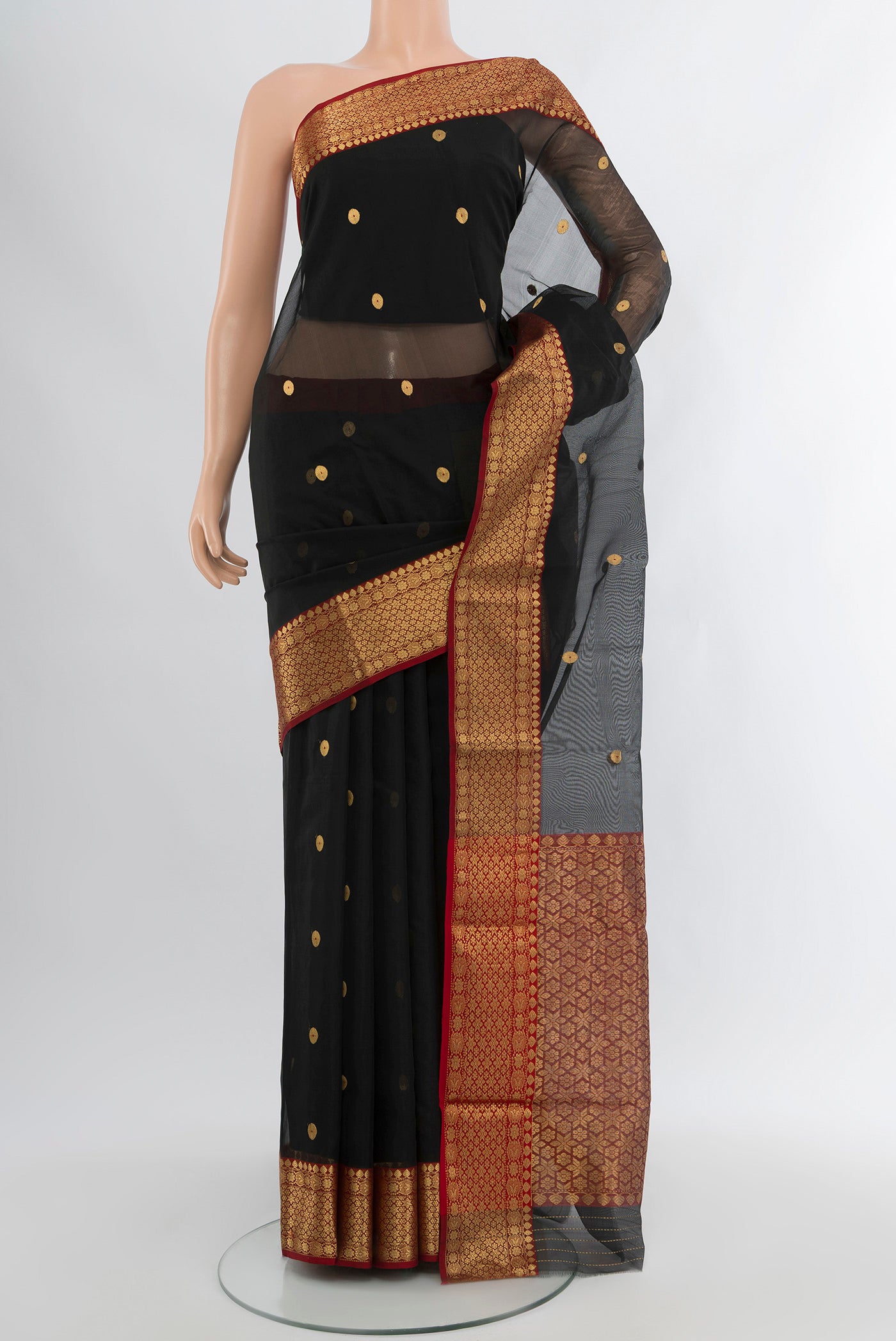 Black Chanderi Silk Cotton Saree with Zari Butta on the body and Zari Border.  displayed on a mannequin