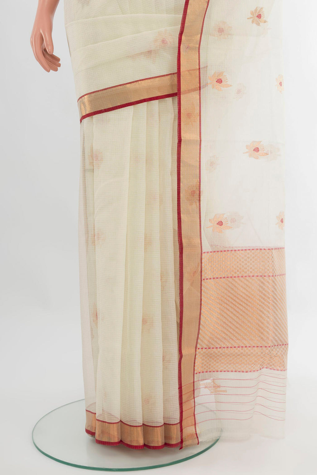 Pleats and pallu of White Kota Silk Saree with Zari Butta on the body and Zari Border. 