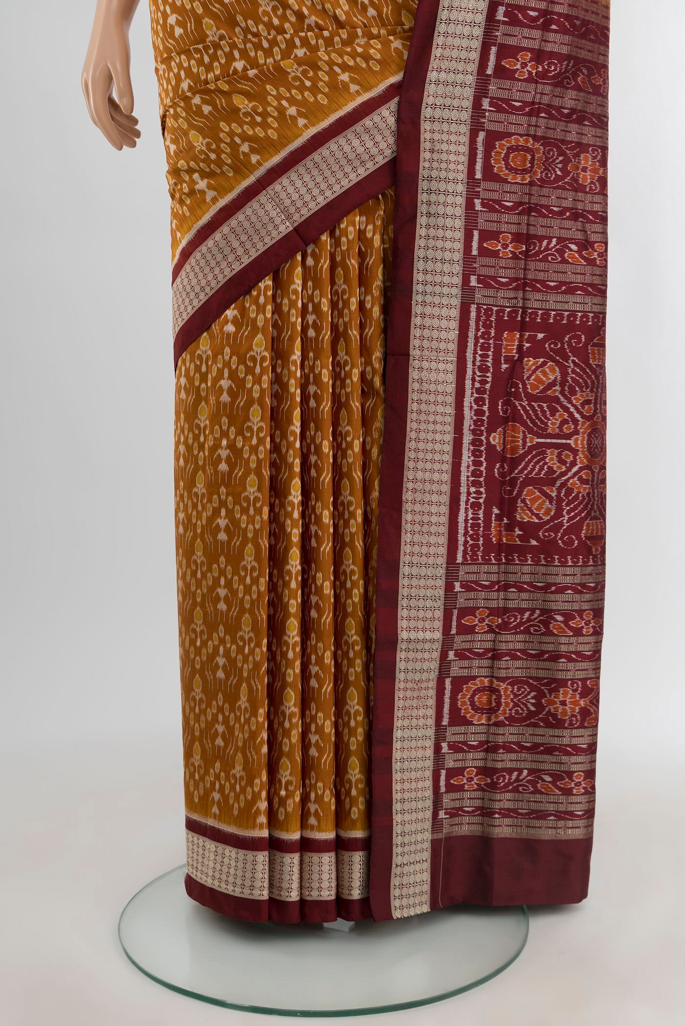 Pleats and pallu of Mustard Orissa Silk Saree with Pure Ikat on the body and Thread Border. 