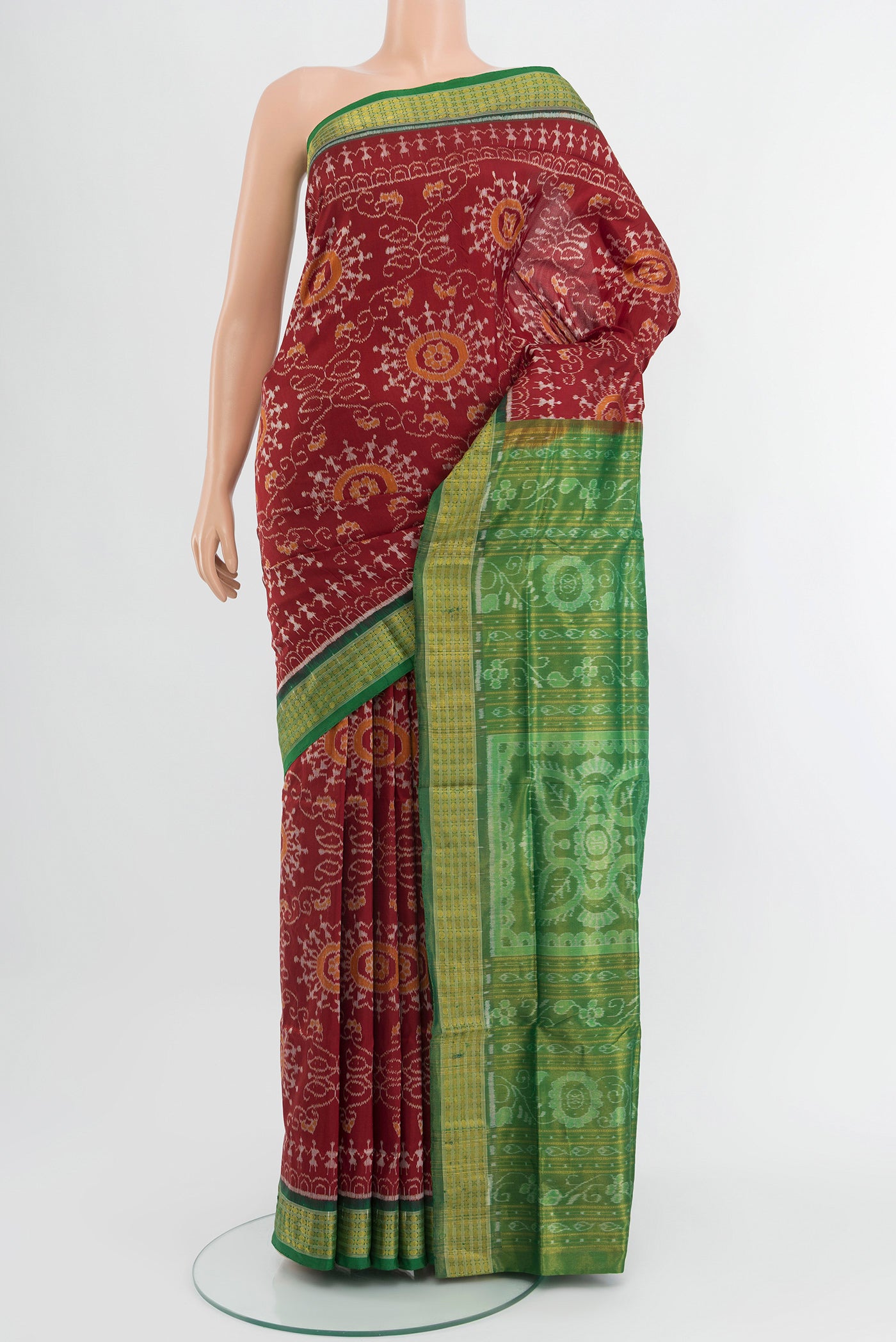 Maroon Orissa Silk Saree with Pure Ikat on the body and Zari Border.  displayed on a mannequin