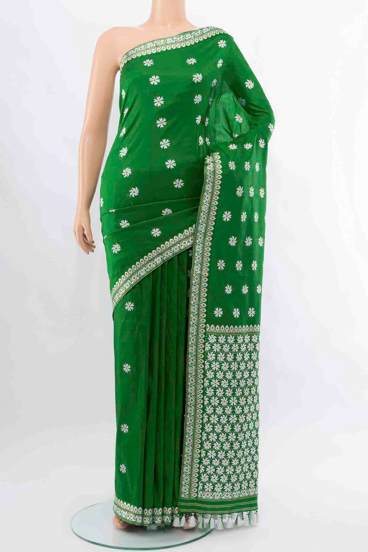 Bottle Green Assam Silk Saree with Thread Butta on the body and Silk Border displayed on a mannequin