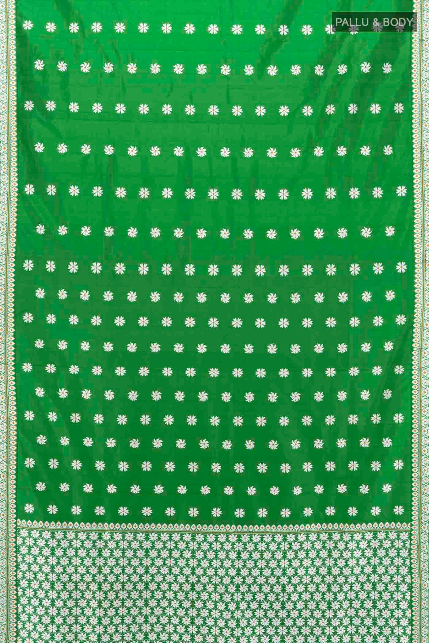 Flat view of Bottle Green Assam Silk Saree with Thread Butta on the body and Silk Border