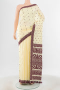 Cream Assam Silk Saree with Jacquard With Thread Butta on the body and Silk Border.  displayed on a mannequin