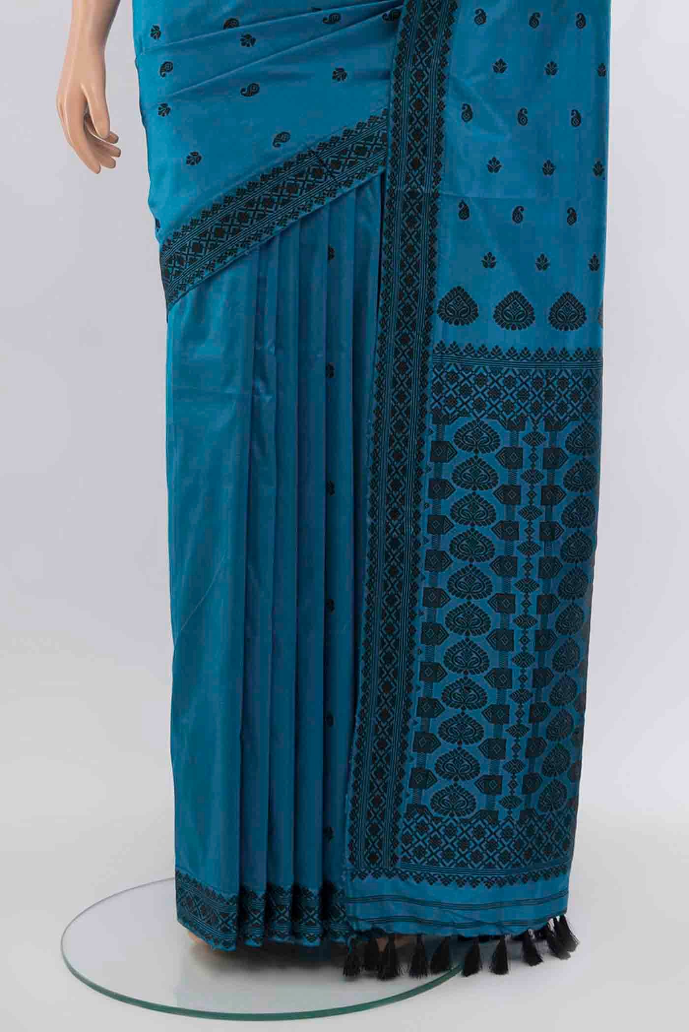 Pleats and pallu of Light Blue Assam Silk Saree with Zari Butta on the body and Silk Border. 