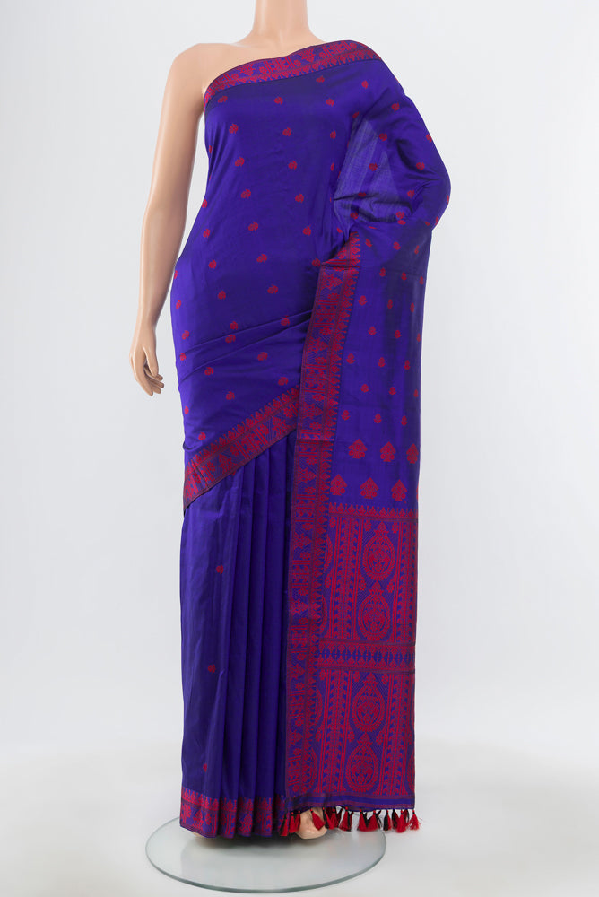 Dark Blue Assam Silk Saree with Jacquard With Thread Butta on the body and Silk Border.  displayed on a mannequin