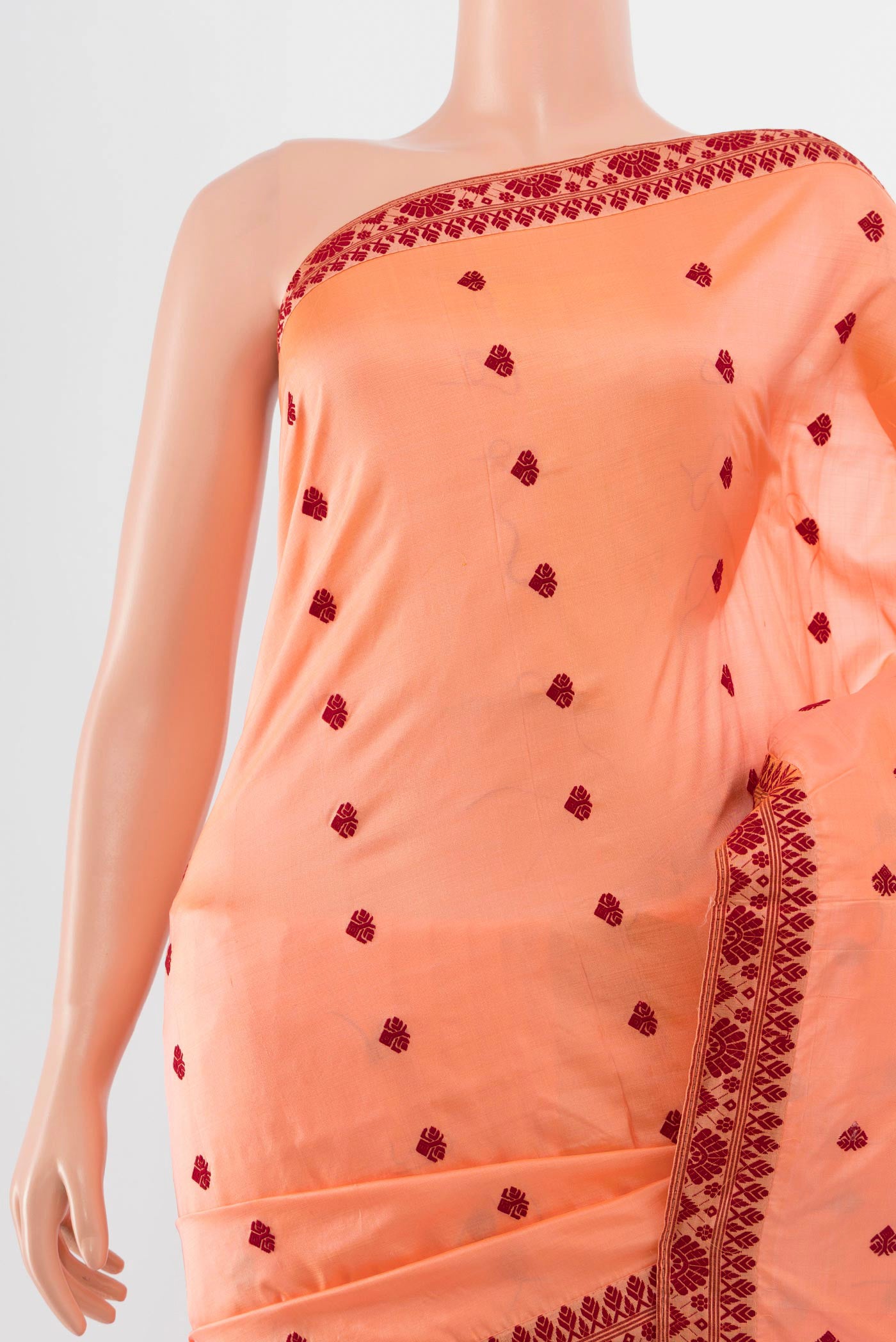 Border image of Orange Assam Silk Saree with Jacquard With Thread Butta on the body and Silk Border. 