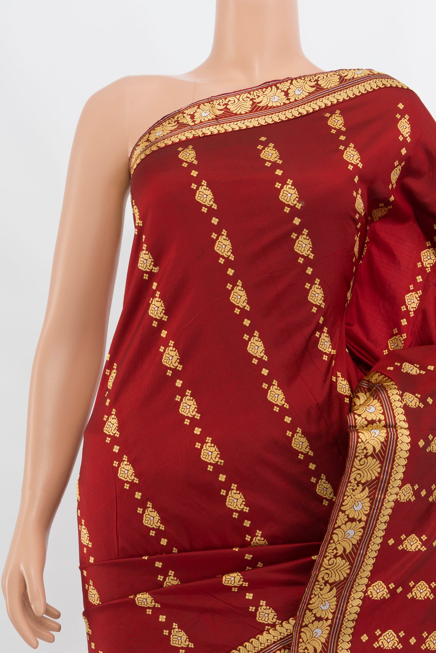 Border image of Maroon Assam Silk Saree with Thread Butta on the body and Silk Border. 
