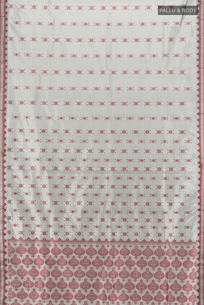 Flat view of Grey Assam Silk Saree with Zari Butta on the body and Silk Border. 