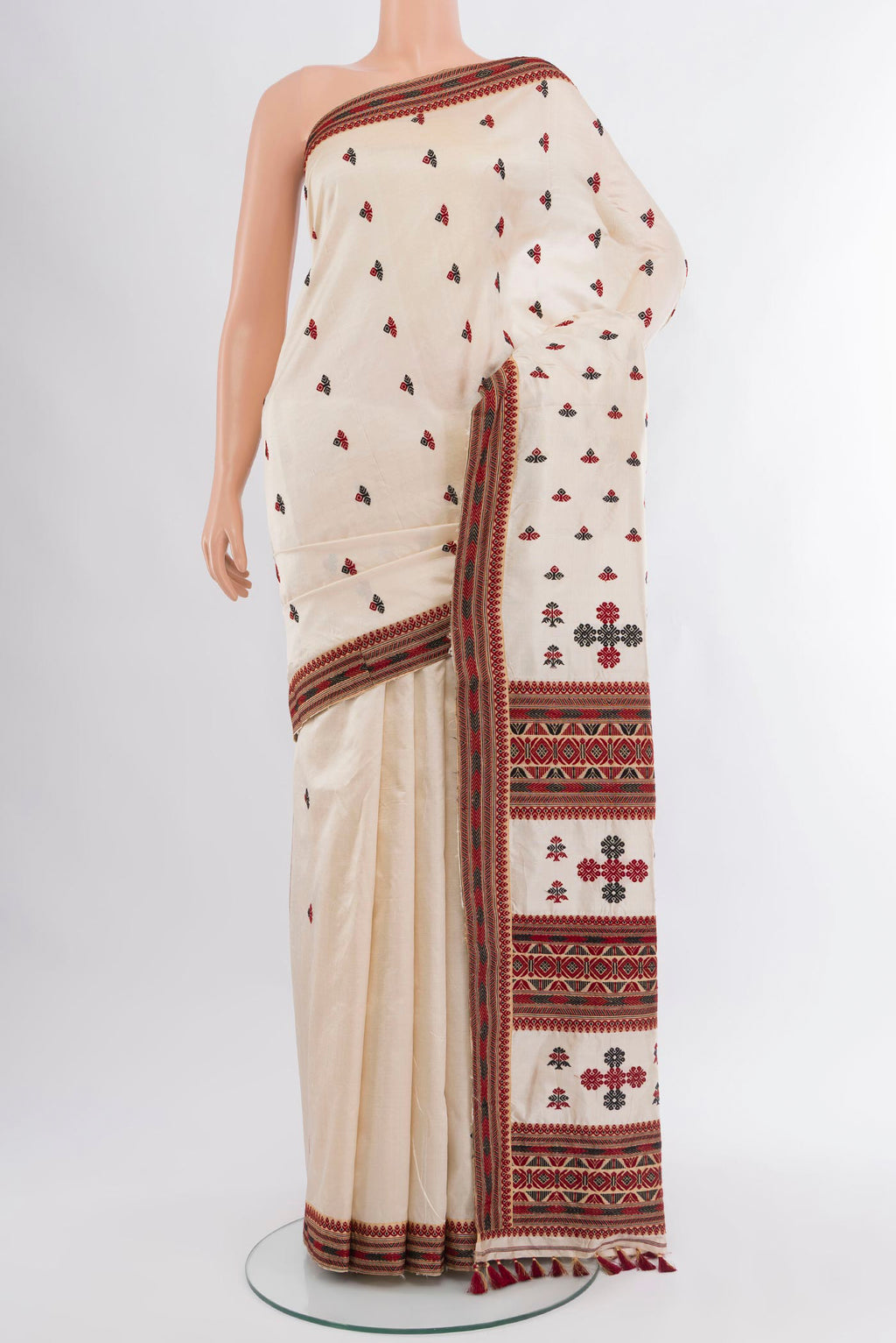 Off White Assam Silk Saree with Thread Butta on the body and Thread Border.  displayed on a mannequin