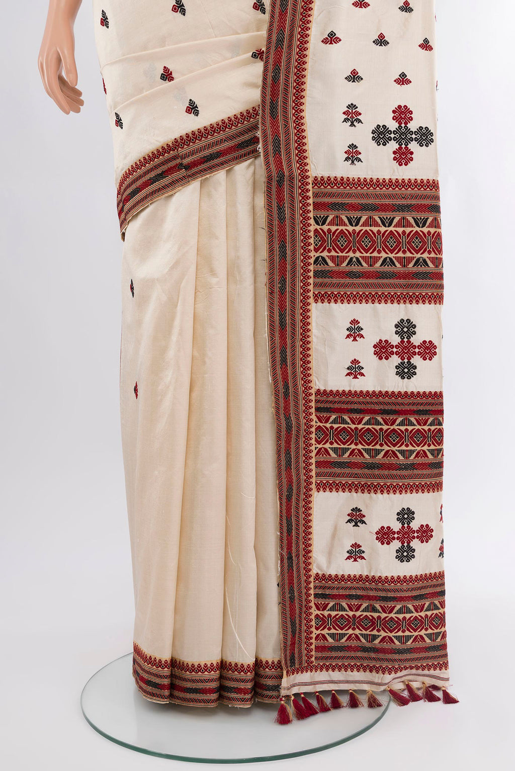 Pleats and pallu of Off White Assam Silk Saree with Thread Butta on the body and Thread Border. 