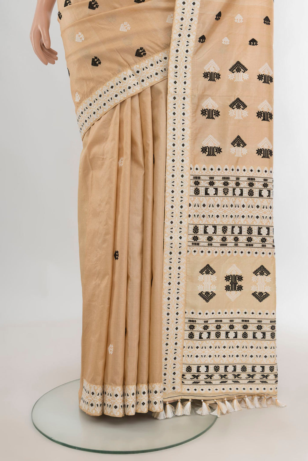 Pleats and pallu of Pure Silk Beige Assam Saree with Thread Butta on the body and Thread Border. 