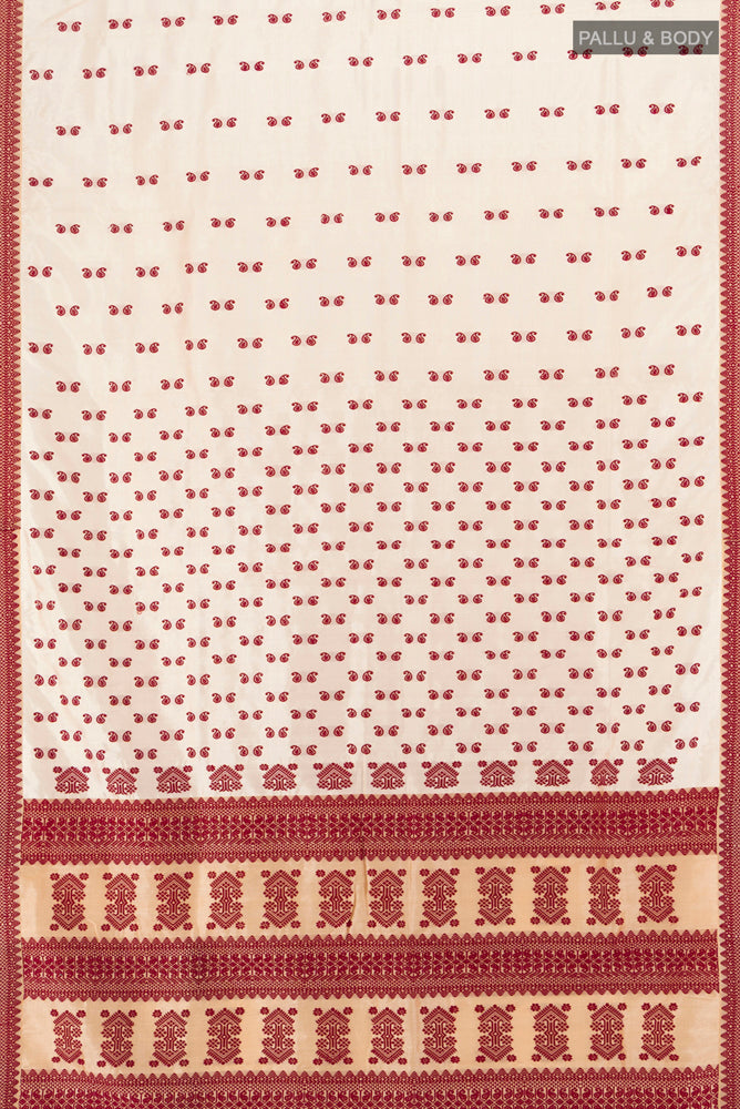 Flat view of Cream Assam Silk Saree with Jacquard With Thread Butta on the body and Silk Border. 