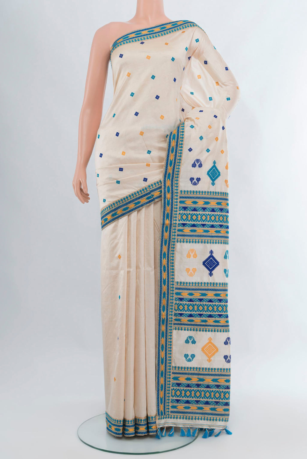 Cream Assam Silk Saree with Thread Butta on the body and Thread Border.  displayed on a mannequin
