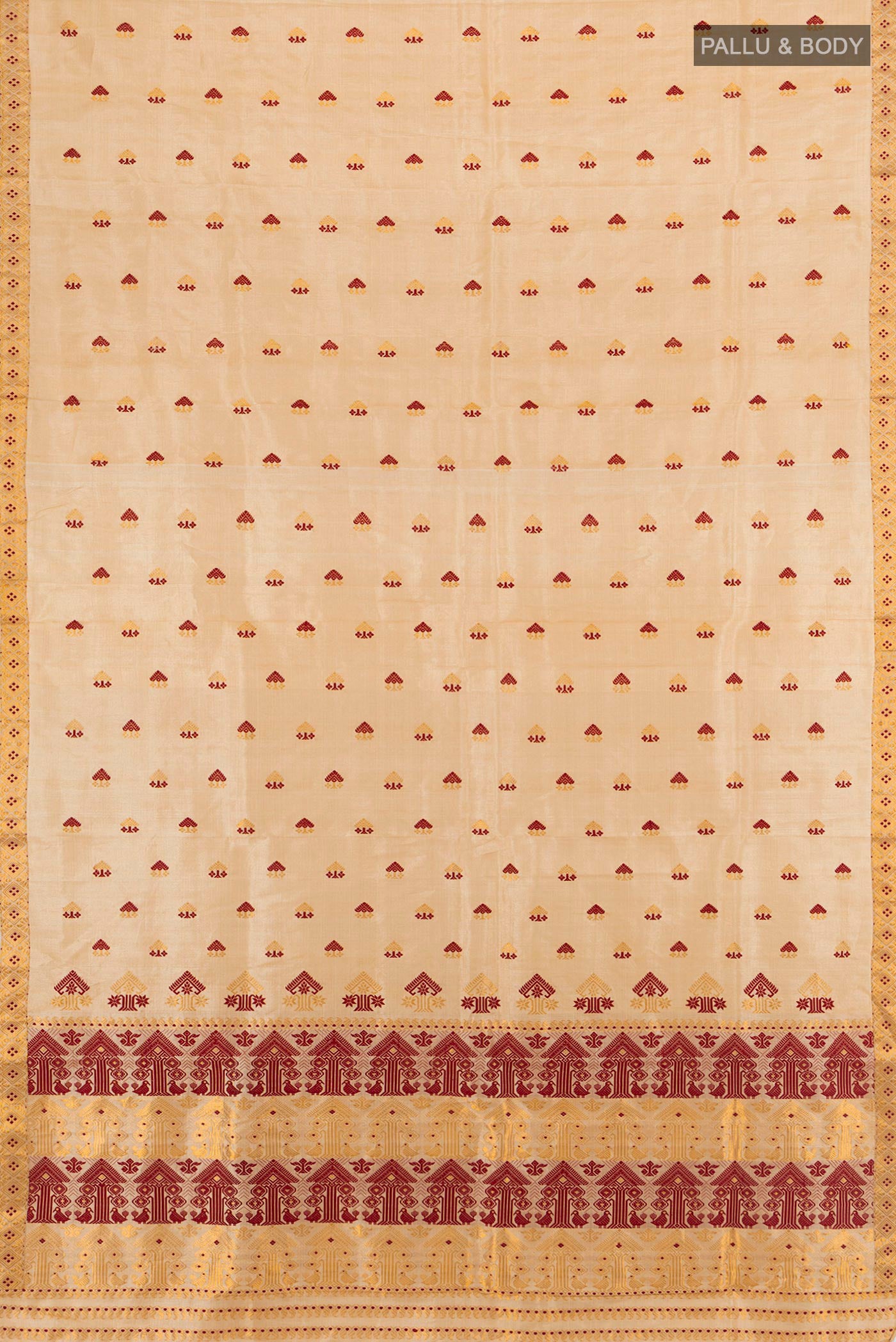 Flat view of Sandal Assam Silk Saree with Thread Butta on the body and Thread Border. 