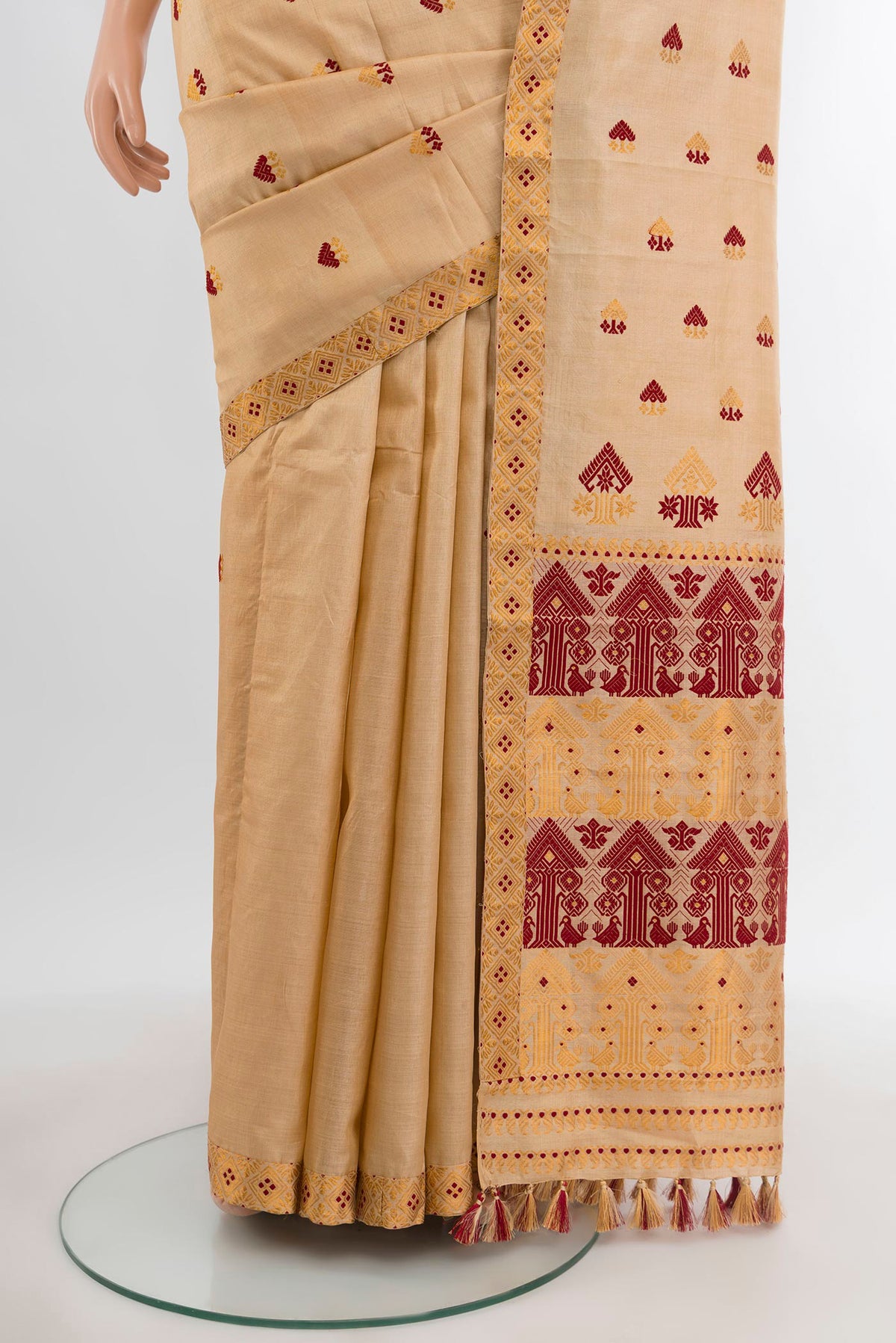 Pleats and pallu of Sandal Assam Silk Saree with Thread Butta on the body and Thread Border. 