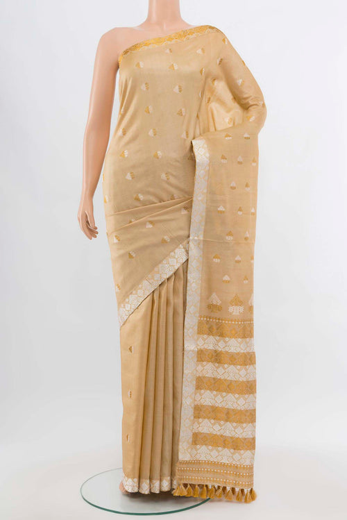Beige Assam Silk Saree with Zari Butta on the body and Silk Border displayed on a mannequin