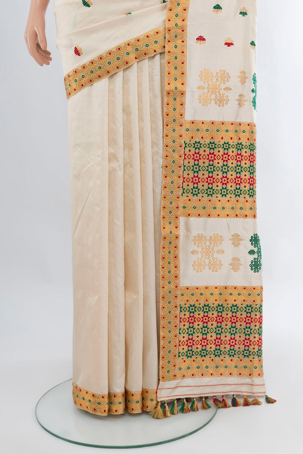 Pleats and pallu of Off White Assam Silk Saree with Thread Butta on the body and Thread Border. 
