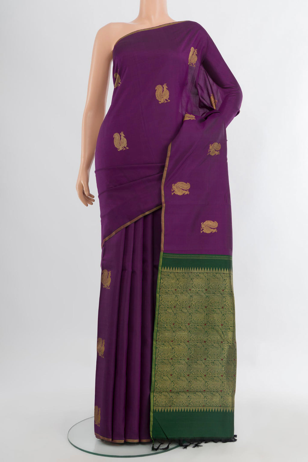 Pure Silk Pure Zari Violet Kanchipuram Saree with Zari Butta on the body and Silk Border.  displayed on a mannequin
