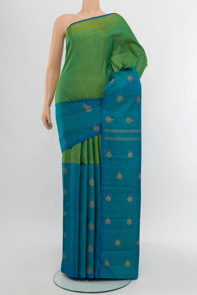 Pure Silk Pure Zari Multi Color Kanchipuram Saree with Zari Butta on the body and Silk Border.  displayed on a mannequin