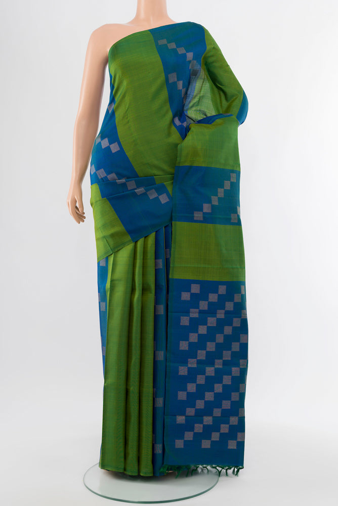 Pure Silk Pure Zari Multi Color Kanchipuram Saree with Zari Butta on the body and Silk Border.  displayed on a mannequin