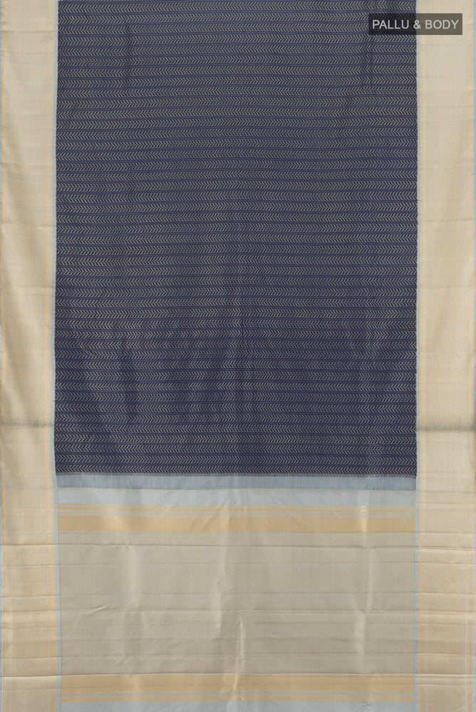 Flat view of Navy Blue Kanchipuram Silk Saree with Zari Butta on the body and Silk Border. 