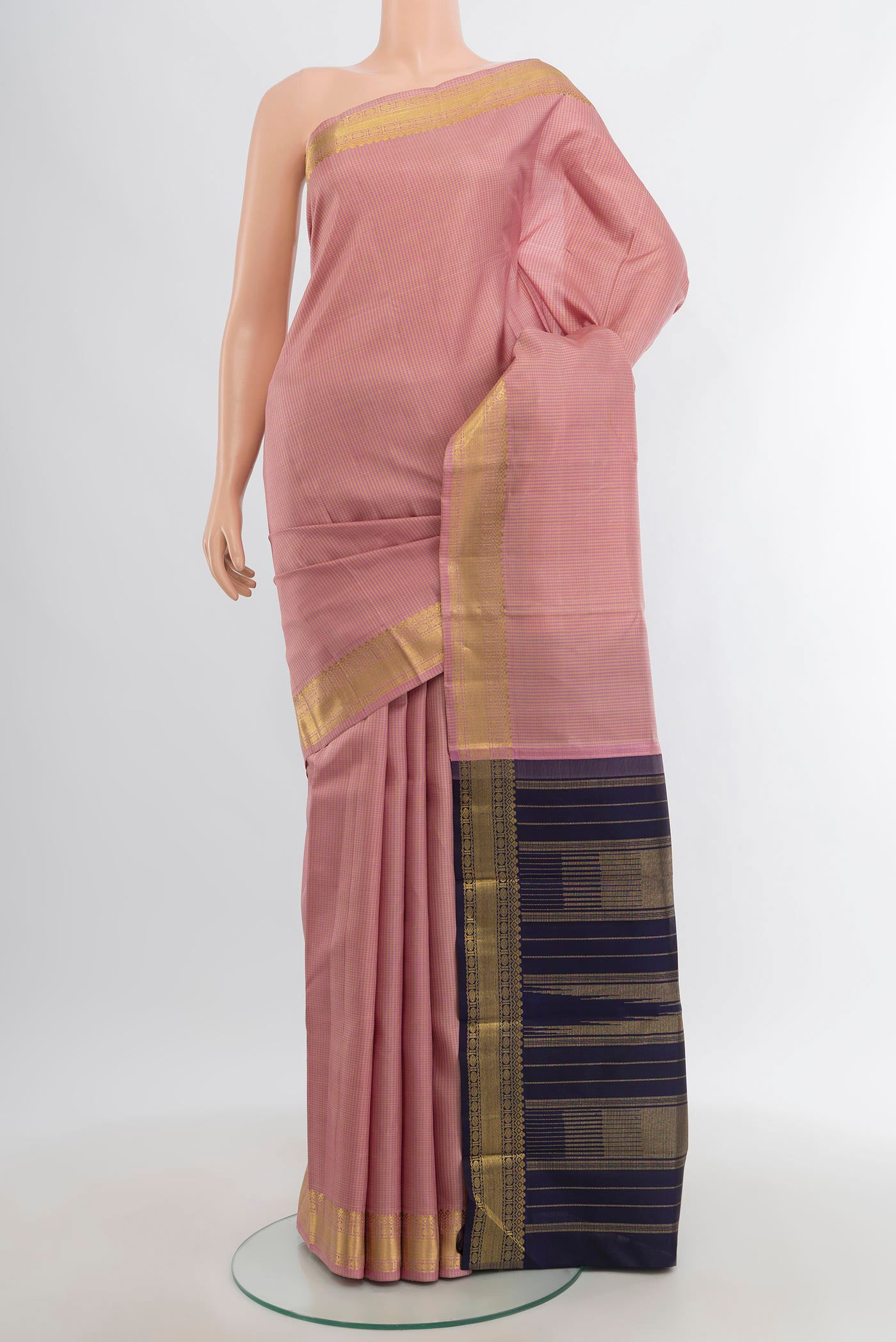 Pure Silk Pure Zari Rose Gold Kanchipuram Saree with Checked design on the body and Zari Border.  displayed on a mannequin