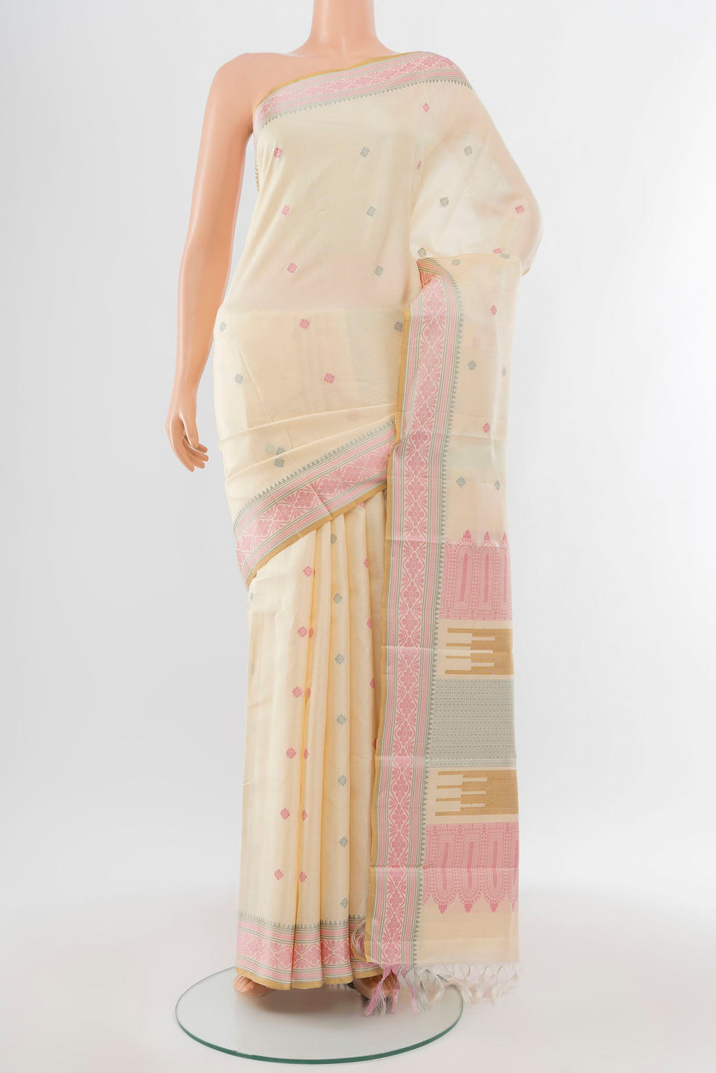 Pure Silk Pure Zari Cream Kanchipuram Saree with Zari Butta on the body and Silk Border.  displayed on a mannequin