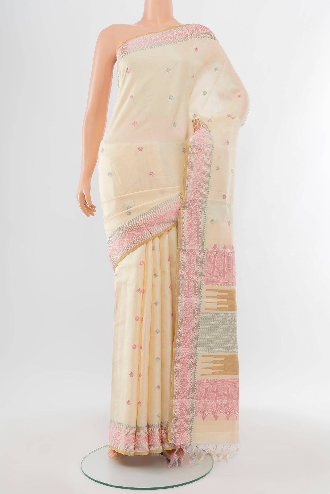 Pure Silk Pure Zari Cream Kanchipuram Saree with Zari Butta on the body and Silk Border.  displayed on a mannequin