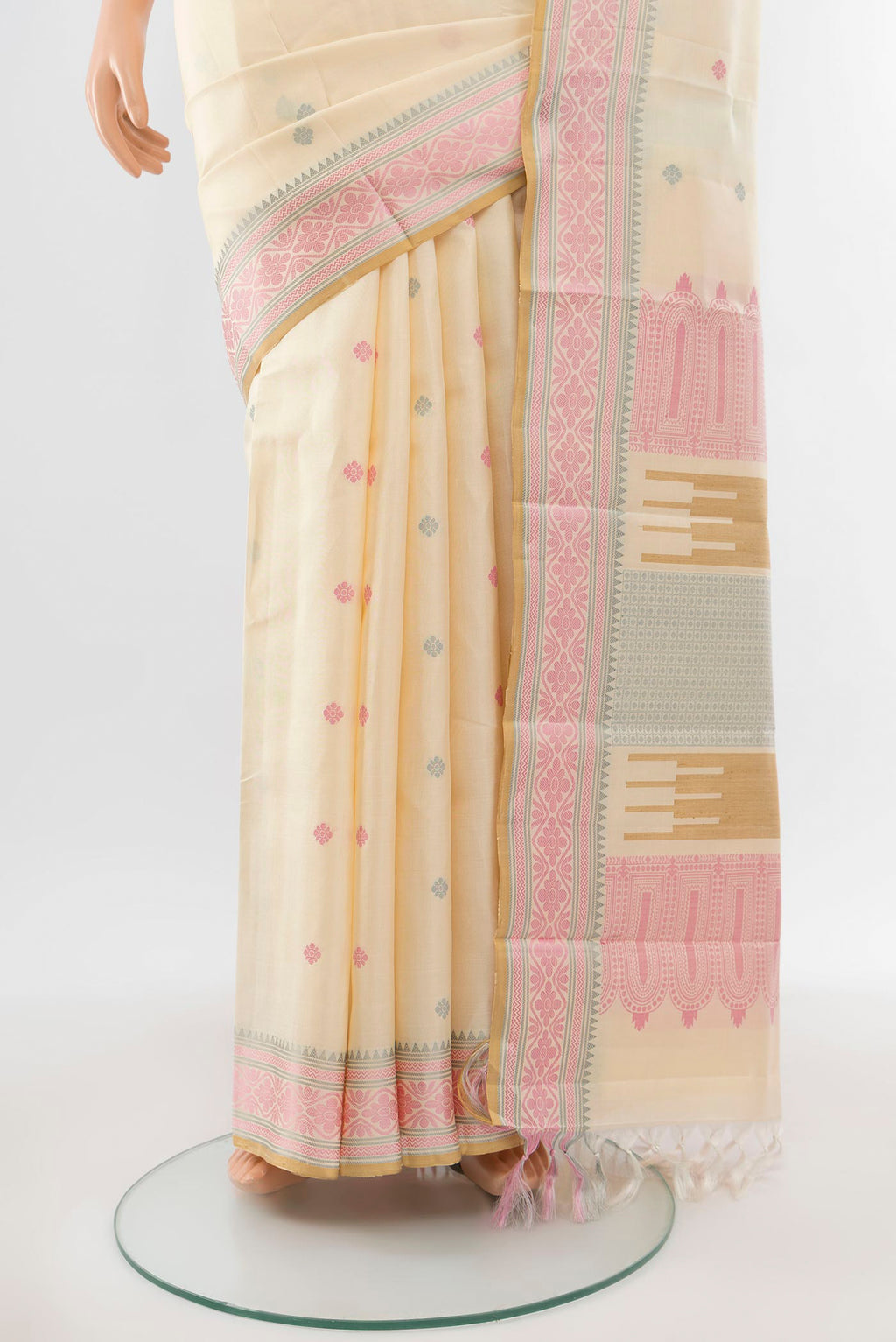 Pleats and pallu of Pure Silk Pure Zari Cream Kanchipuram Saree with Zari Butta on the body and Silk Border. 